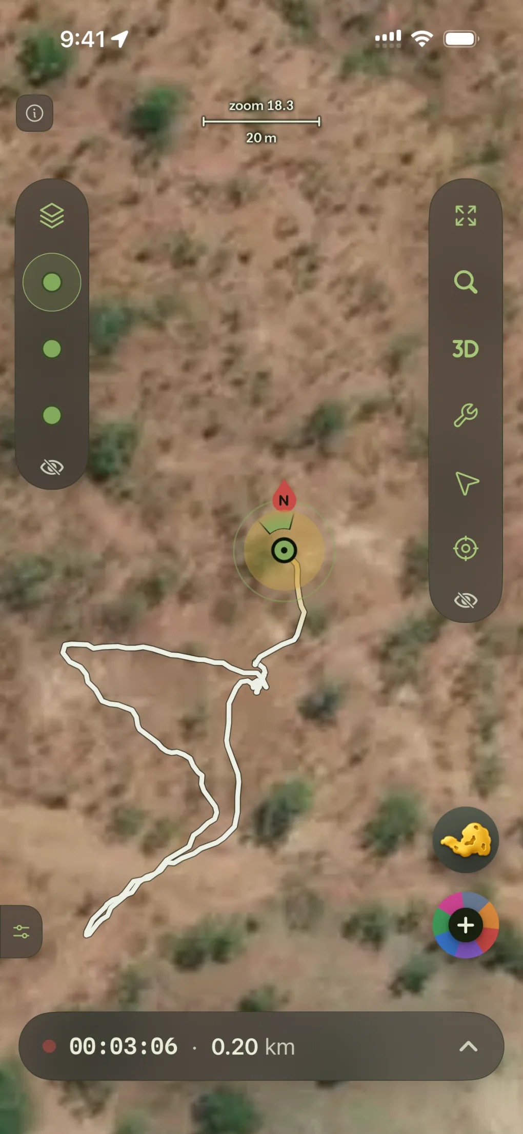 A live recording over bare ground, the walked track drawn in white, with elapsed time and distance at the bottom.
