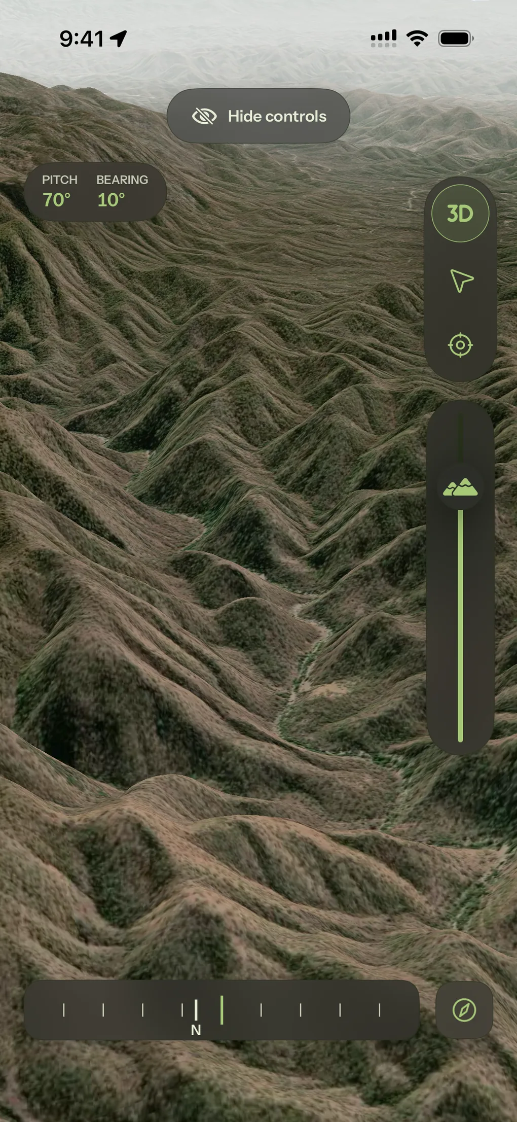 A 3D view over shaded relief with pitch and bearing shown on the compass readout.