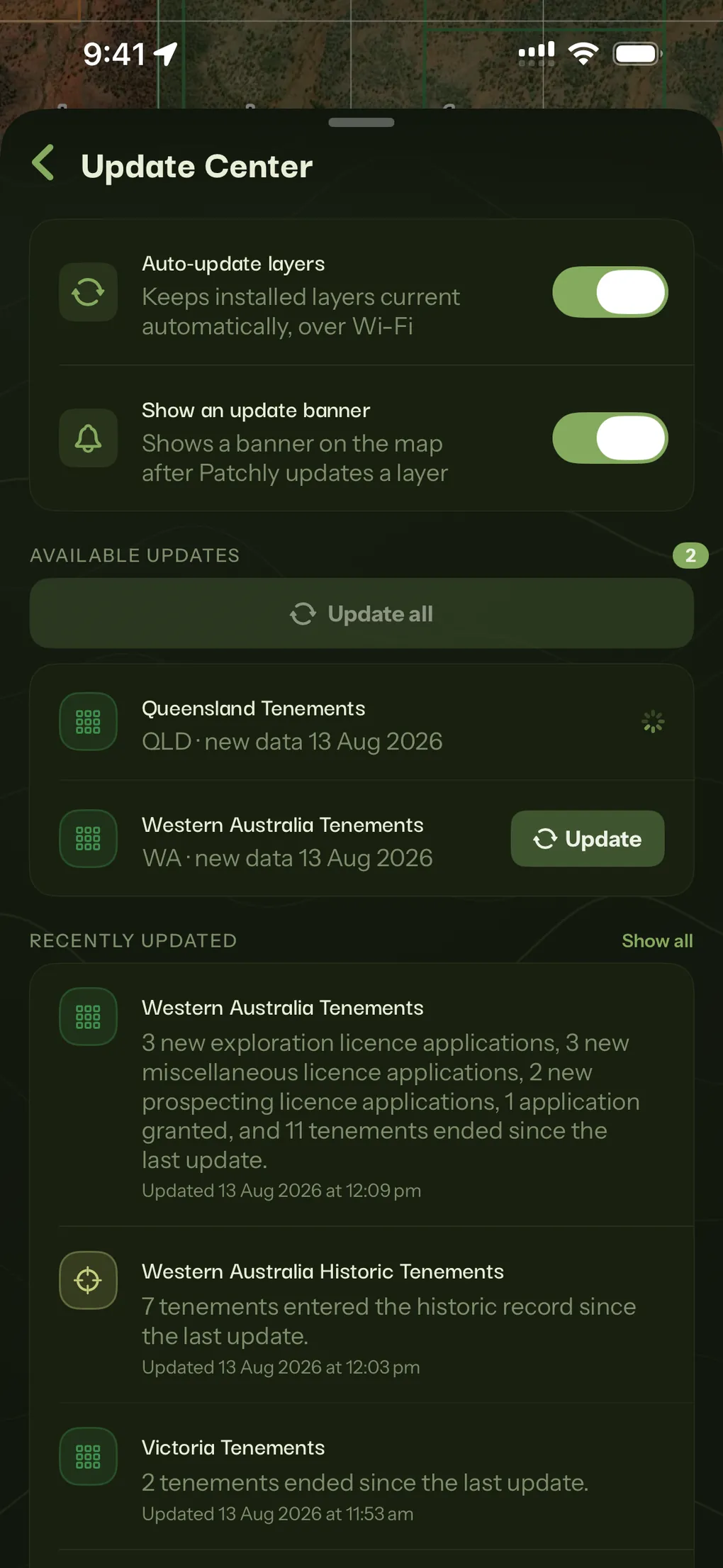 The Update Center with auto-update on, two tenement layers carrying new data, and a plain-English note of what changed in each.